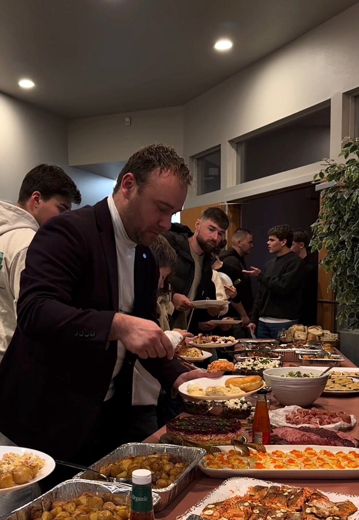 Church family sharing a meal